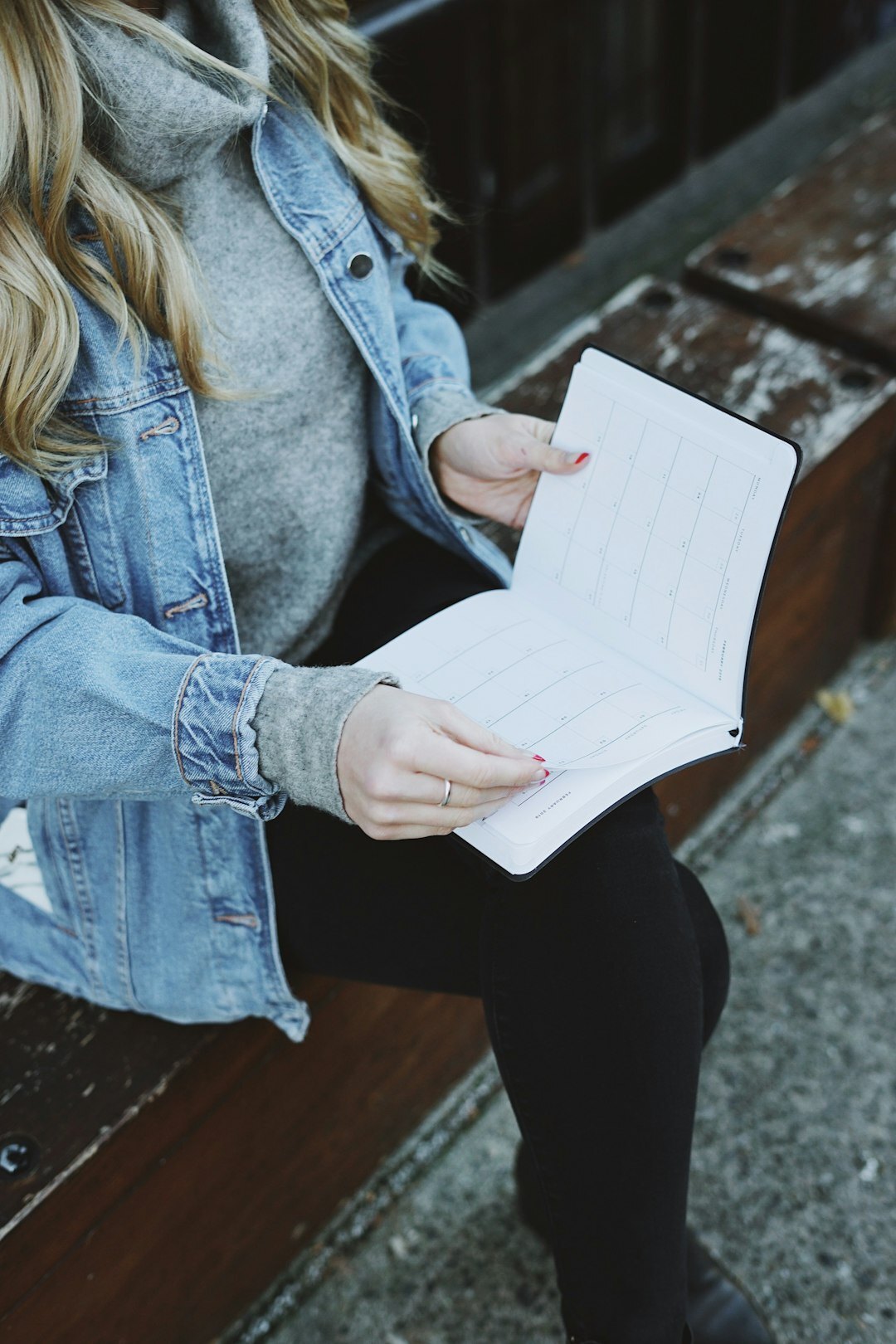 Editor reading printed reports at a newsroom desk
