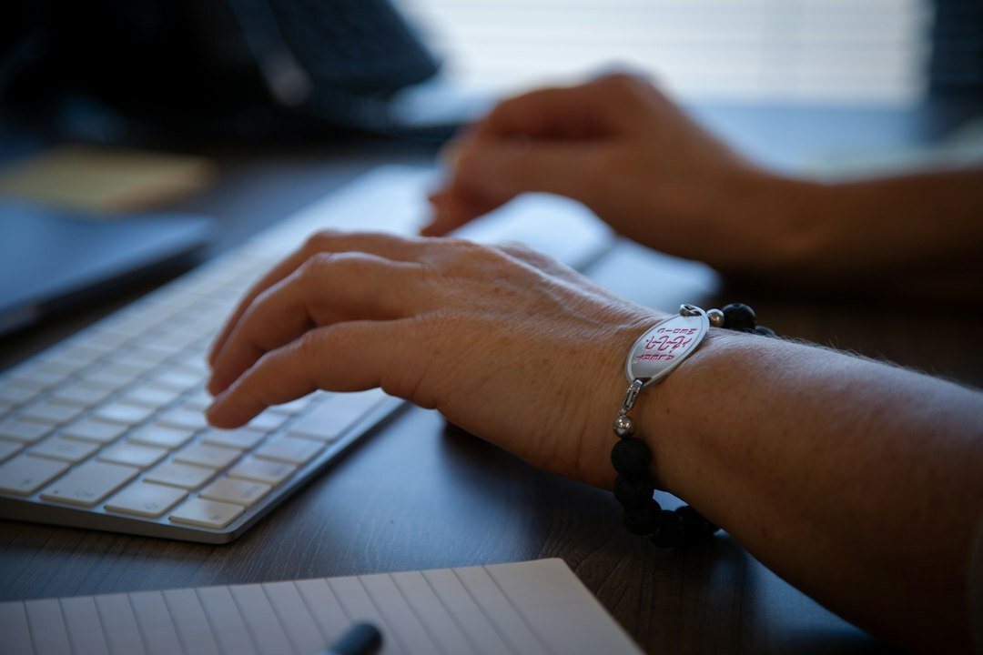 close up of hands on keyboard