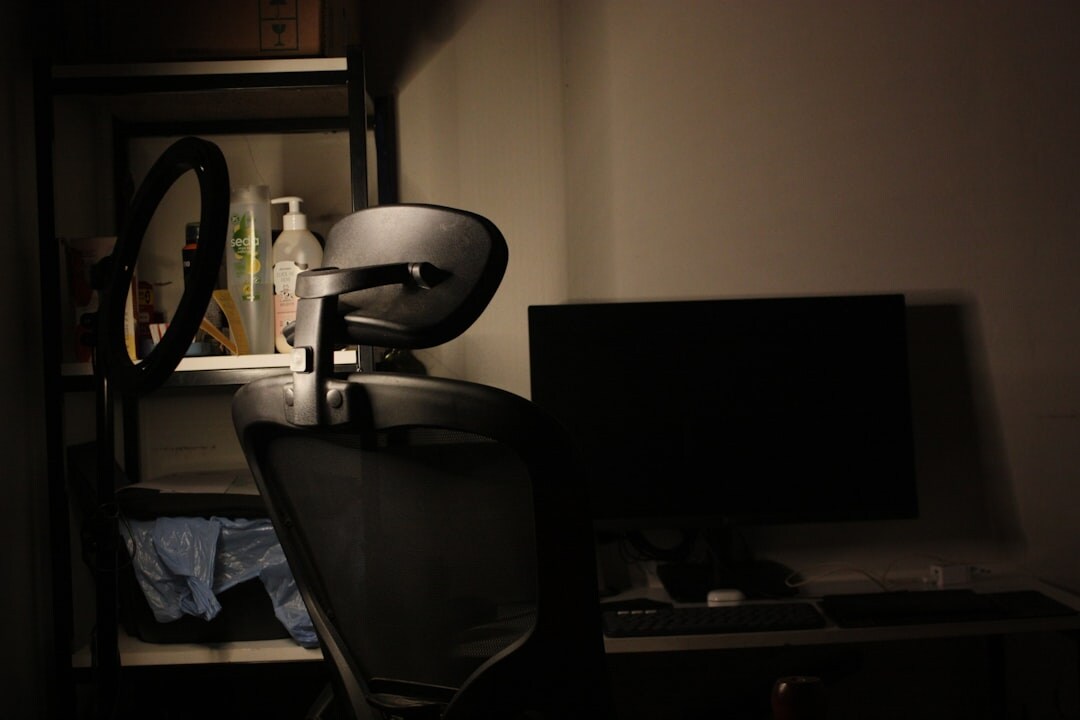 detective using laptop in dark room